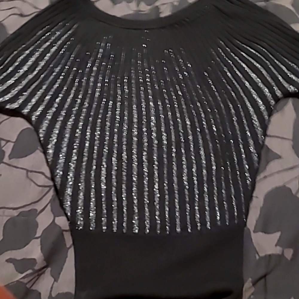 Beautiful sweater,ribbed,black with silver in between ribs. Looks fabulous on